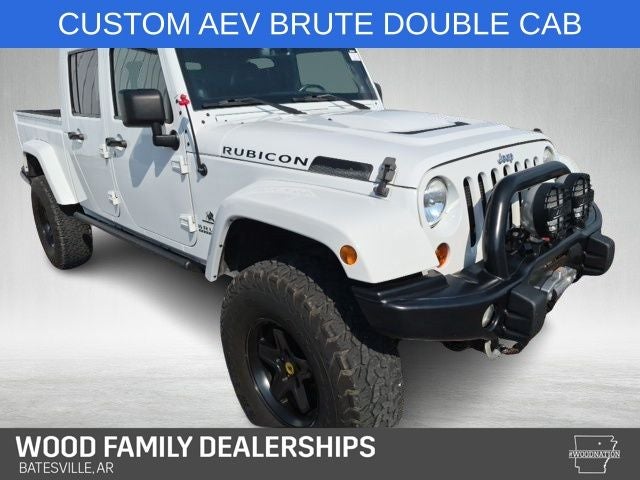 2013 Jeep Wrangler Unlimited Rubicon in Bright White Clearcoat — front three-quarter view
