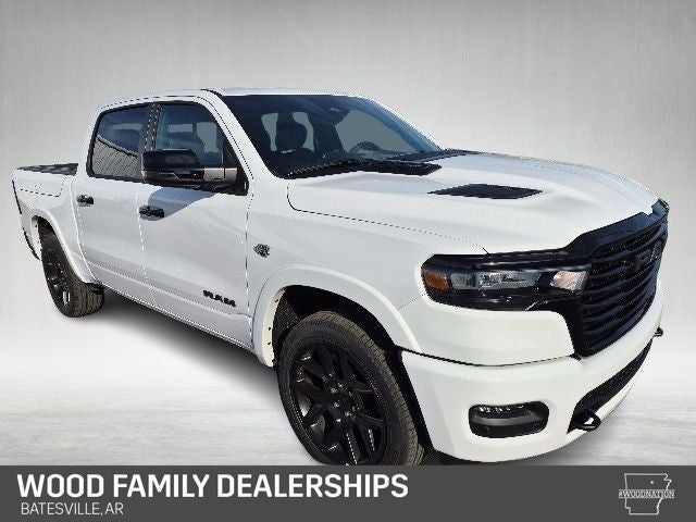 2026 RAM Ram 1500 RAM 1500 LARAMIE CREW CAB 4X4 5'7' BOX in Bright White Clear-Coat Exterior Paint — front three-quarter view