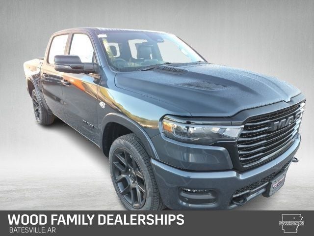 2026 RAM Ram 1500 RAM 1500 LARAMIE CREW CAB 4X4 5'7' BOX in Forged Blue Metallic Exterior Paint — front three-quarter view