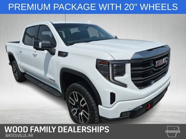 2024 GMC Sierra 1500 4WD Crew Cab Short Box AT4 in Summit White — front three-quarter view