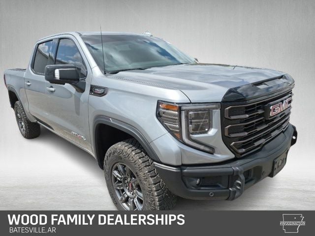 2024 GMC Sierra 1500 4WD Crew Cab Short Box AT4X in Sterling Metallic — front three-quarter view